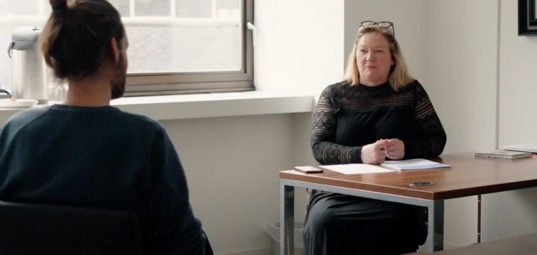 Person filling out consultation form