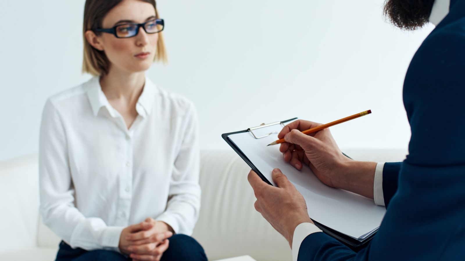 Adult ADHD assessment consultation with a clinician taking notes